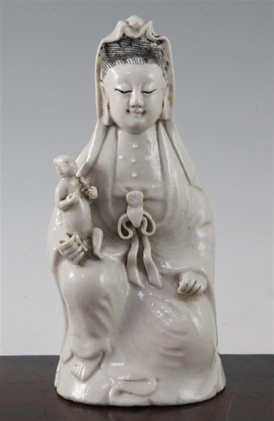 Chinese white glazed porcelain figure of Guanyin holding a child, Jiaqing period, 21cm, childs head re-stuck(-)